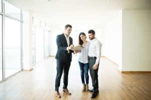 real estate agent meeting with clients