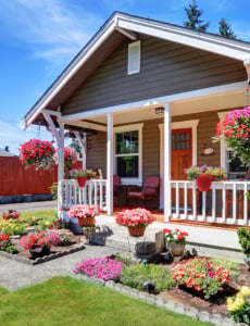 Cute American House Exterior With Covered Porch And Flower Pots