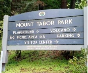Mount Tabor Park entrance sign surrounded by greenery