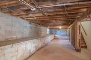 Basement in a home with open rafters, electrical. Radon should be tested.
