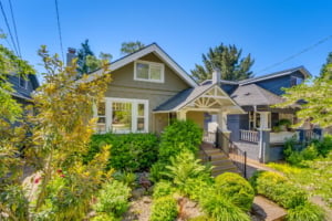 Charming single-family home featuring elegant landscaping and classic architecture, perfect for Portland real estate enthusiasts.