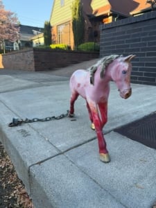Whimsical Portland Horse Project toy enhances the curb appeal of this residential Portland home, showcasing unique exterior features.
