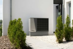 Energy-efficient heating unit outside a modern single-family home, enhancing comfort and sustainability in Portland real estate.